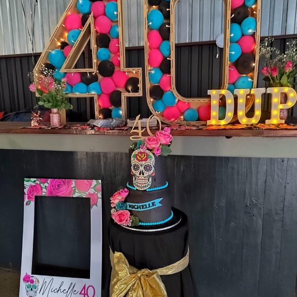 Photo frame board and marquee letters at a 40th party